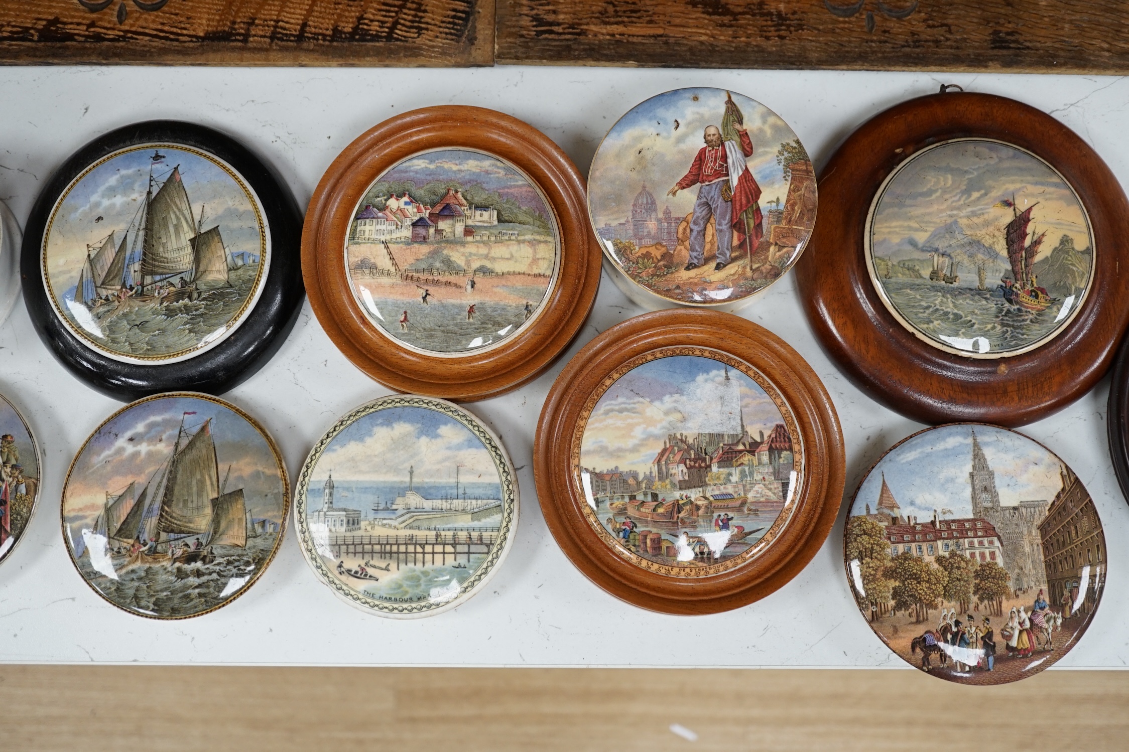 Eleven 19th century mostly framed pot lids including ‘The Ning Po River’, ‘Rifle Contest Wimbledon 1868’, ‘Vue De La Ville De Strasbourg Prise De Port’ etc. Condition - fair to good